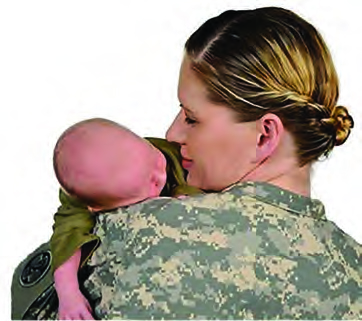 Woman wearing fatigues, holding a baby