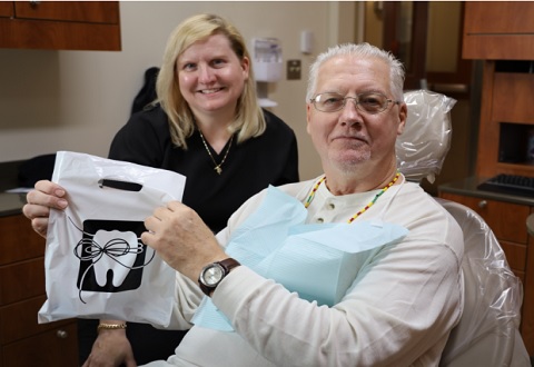 Jennifer Brown, VA dental assistant, with Veteran
