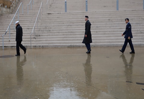 Service members walking in rain