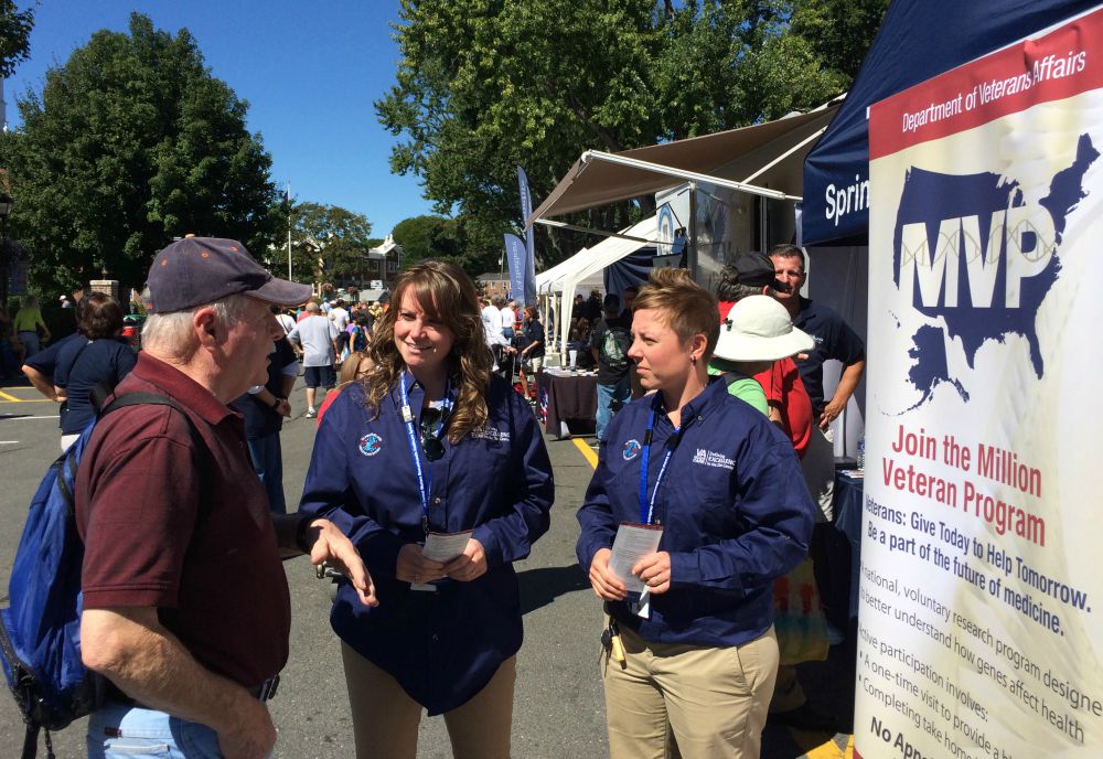 MVP Research coordinators explain the program to a Veteran during an outreach event